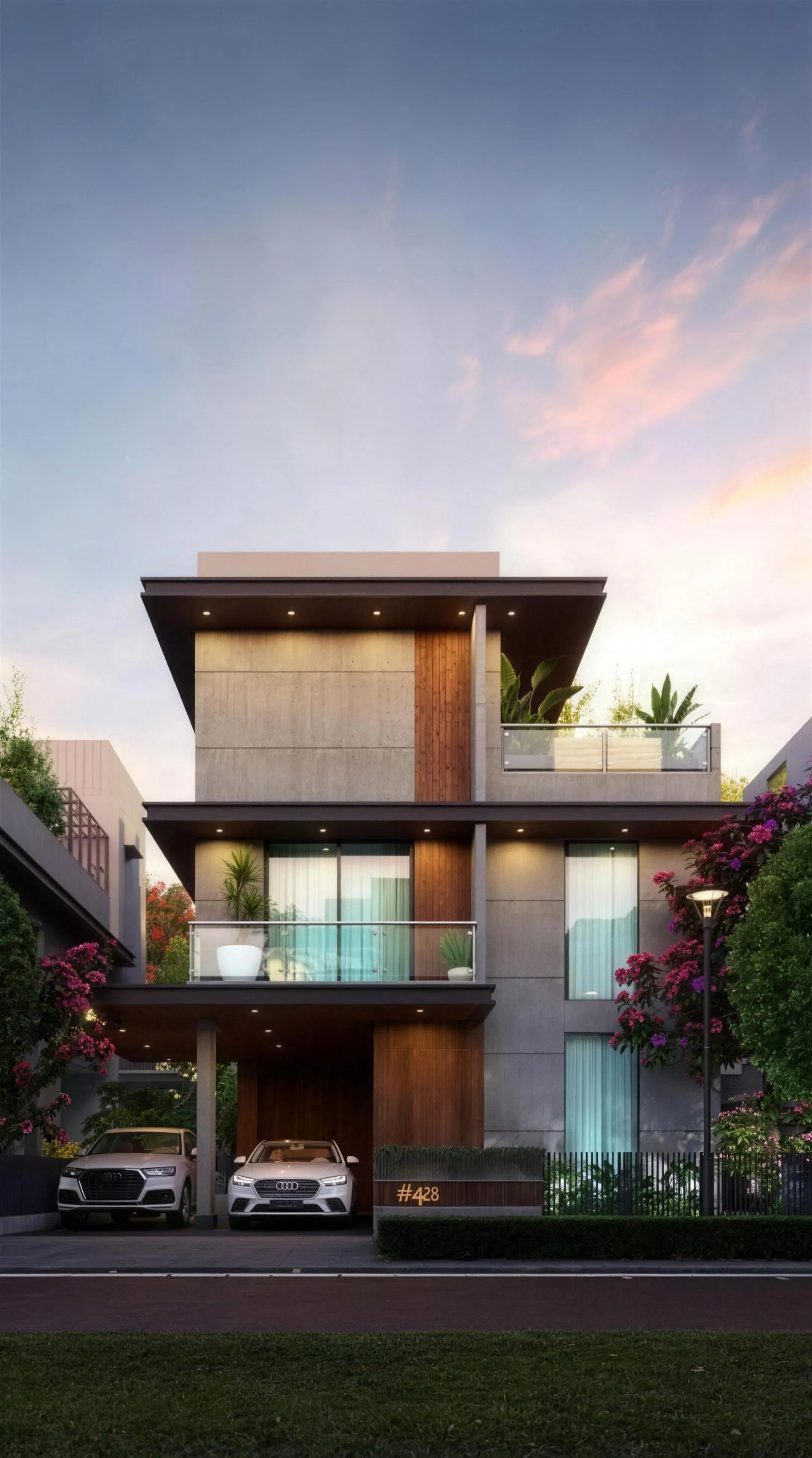 Modern three-storey villa at dusk with balconies, planters and a covered car porch